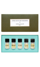 Load image into Gallery viewer, Astier de Villatte discovery set of five eaux de cologne fragrance, 10ml glass bottles in a luxurious green box decorated with gold clover motifs, available at Amara Home.
