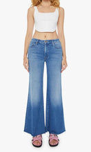 Load image into Gallery viewer, Woman standing wearing Mother Denim The Roller Fray jeans, in colour Work Hard Play Hard, available at Amara Home.
