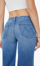 Load image into Gallery viewer, Close up of woman standing, back view, wearing Mother Denim The Roller Fray jeans, in colour Work Hard Play Hard, available at Amara Home.
