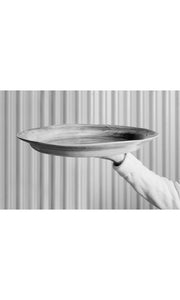 Arm outstretched holding large Mediterranean Platter, handmade by Wonki Ware in South Africa, available at Amara Home.